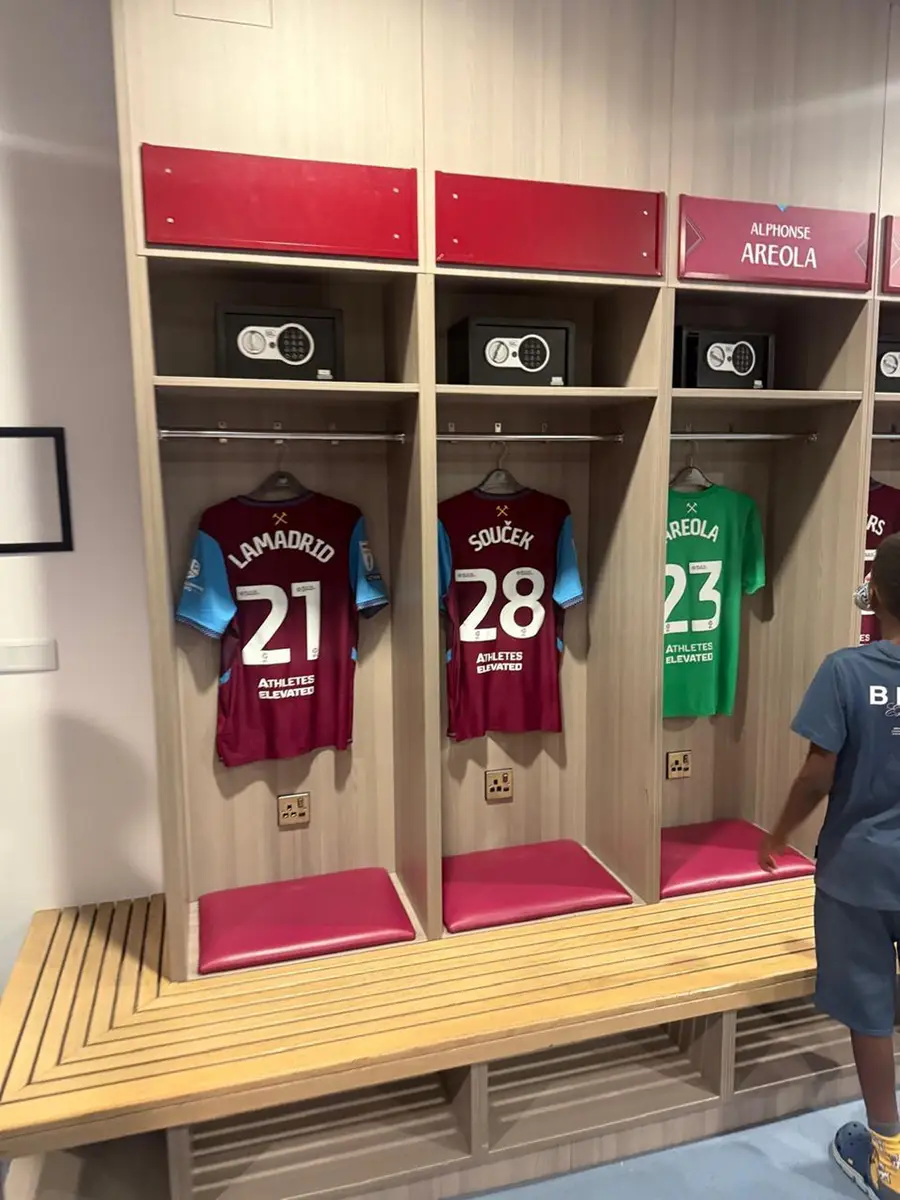 Football shirts displayed inside the West Ham stadium changing room